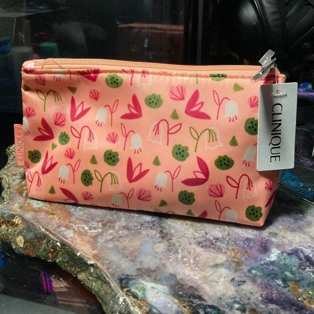 Clinique pink pouch with four Clinique products